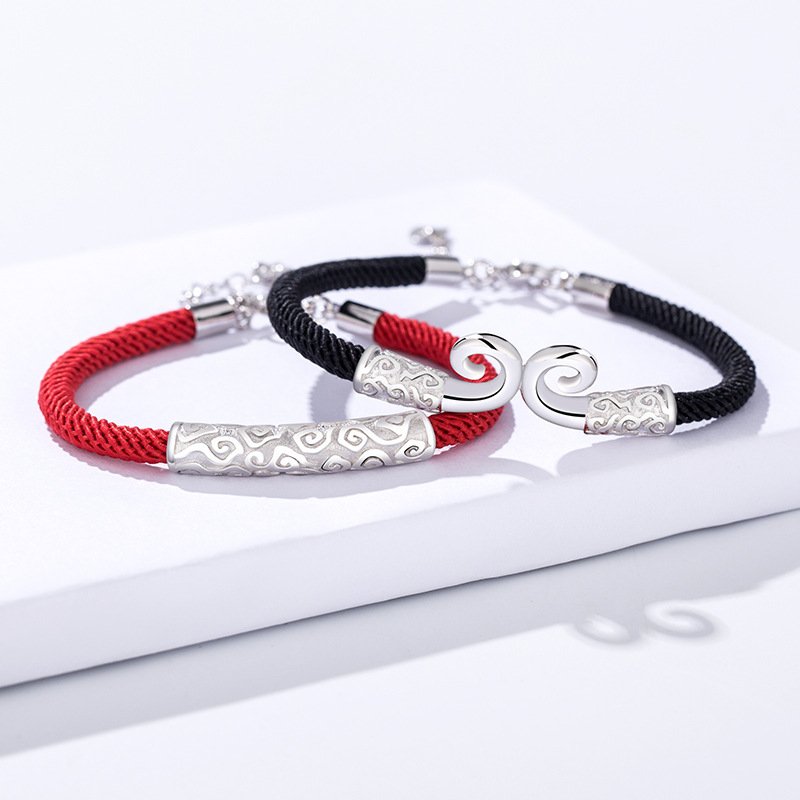 A pair of curse couple red rope bracelets